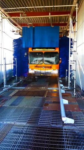 Transit Wash System Cleaning City Bus in Outdoor Wash Bay